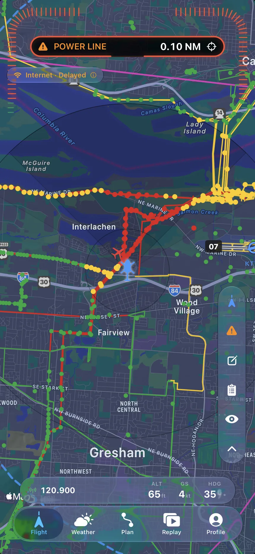 The LowOps moving map: a dark chart dense with colour-coded obstacle and power-line spans.